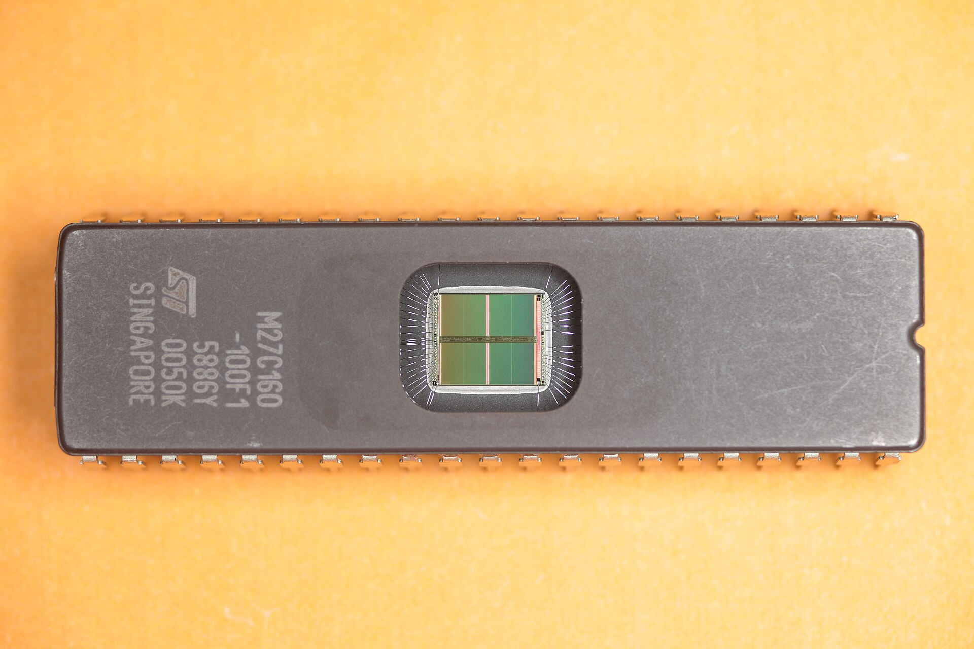 UV-erasable EPROM chip — the moment hardware gained the ability to be updated